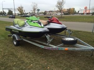 **PAIR OF SEA-DOOS W TRAILER-- 2005 SUPERCHARGED RTX1500, 2004 GTI800 **