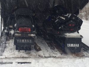 Yahmaha Snowmobiles and enclosed trailer.