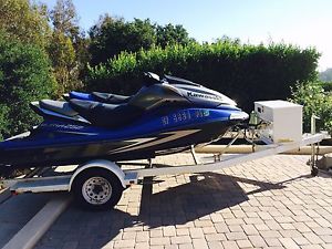 2 Kawasaki Jet skiis, one ultra supercharged, low hours with trailer