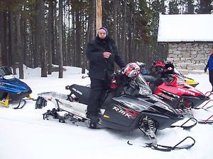 TWO POLARIS SNOWMOBILES WITH TRAILER
