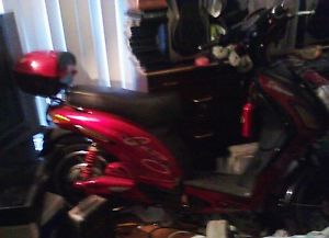 RED ELECTRIC SCOOTER, RARELY USED! PERFECT CONDITION, NO SCRATCHES & SHINY