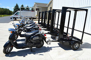 Yamaha Vino Scooters with backlit mobile billboard advertising trailers