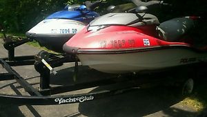 jet ski and trailer one red one blue polaris both 2004