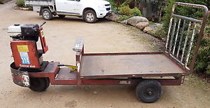 Three wheeled petrol powered utility vehicle