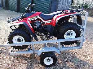 KAWASAKI BAYOU QUAD BIKE ON TRAILER ONLY 31 MILES FROM NEW WITH 3 TRAILERS, MINT