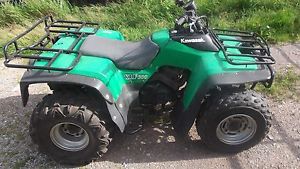 KAWASAKI 300 KLF 2x4, FARM QUAD 5 SPEED +REVERSE.GOOD CONDITION,NOT AGR,REDG..