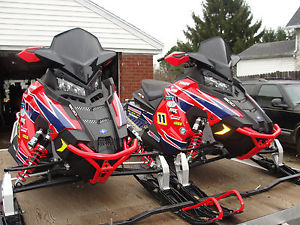 Pair of 2015 Polaris 800 Switchback Snowmobiles and Trailer