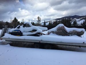 3 snowmobiles with trailer