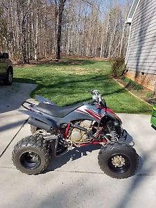 Gray and Red 2008 Yamaha Raptor 250 ATV