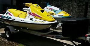 2 JET SKIS. 2 AND THREE SEATER With trailer