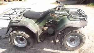 Kawasaki 400 4x4 farm quad atv needs work.