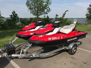 Matched pair (2) 2012 SeaDoo GTI SE 130 Jet Skis with double trailer