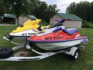 1997 Sea Doo GTI and 1996 Kawasaki ZXI on a dual PWC Trailer